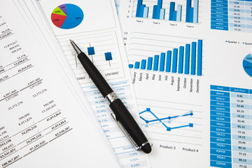 Financial paper charts and graphs