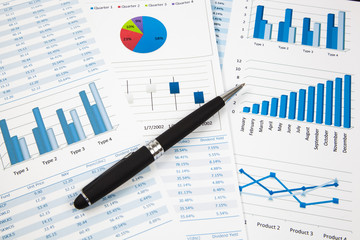 Financial paper charts and graphs