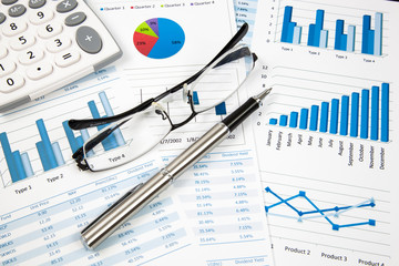 Financial paper charts and graphs
