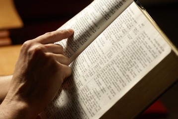 Man reading Holy Bible in the church.