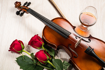 Fototapeta premium Violin, rose, glass of champagne and music books