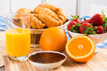 early breakfast, juice, croissants and jam