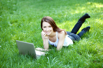 student with notebook outdoor