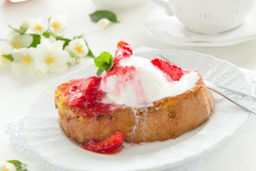 French toast with ice cream and strawberries.