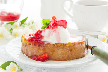 French toast with ice cream and strawberries.
