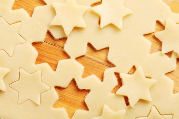 Detail of pastry with star shapes on wooden board