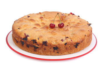 Cherry pie with berries and raisins isolated on white background