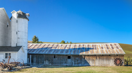 Fototapeta na wymiar Fancy old Barn with wood silo