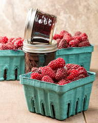 Fresh Tayberries and jars of homemade jam