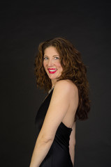 Naklejka premium Attractive middle aged woman in black dress