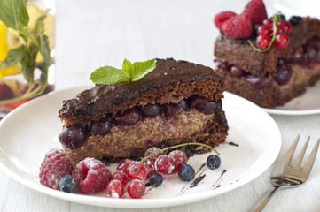 Fototapeta na wymiar Delicious Chocolate cake with fresh berries