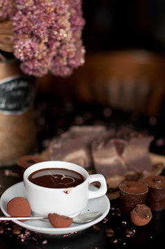 piece of chocolate bar with hot chocolate drink