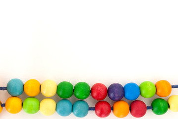 Background with colored wooden pearls