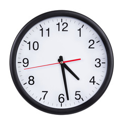 Office clock shows half past four