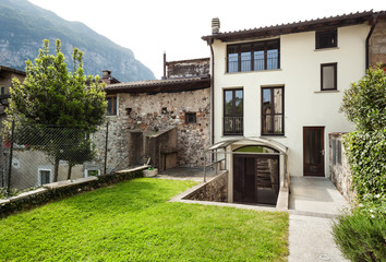 Fototapeta na wymiar house in a typical village in Ticino, view from the garden