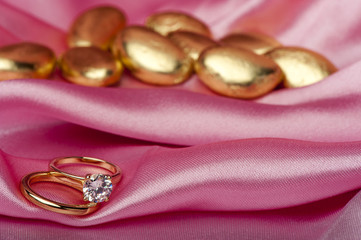  wedding rings on colorful fabric