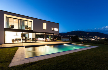 Modern villa with pool, night scene