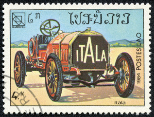 Fototapeta na wymiar stamp printed in Laos showing vintage car, Itala