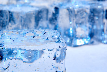 Obraz na płótnie Canvas Abstract photo of ice cubes with blue lighting