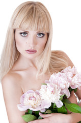 Blonde woman with flowers over white background.