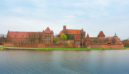 Teutonic castle Malbork in Pomerania region of Poland over Nogat - 53979741