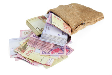 Burlap bag with Ukrainian money, isolated on white