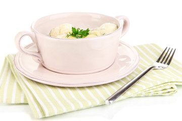 Tender young potatoes with sour cream and herbs in pan isolated