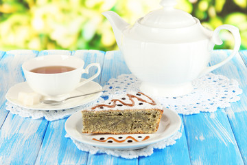 Delicious poppy seed cake with cup of tea