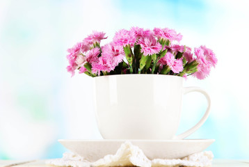 Many small pink cloves in cup