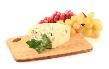 Tasty blue cheese and grape on cutting board, isolated on white