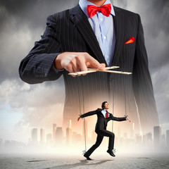 Businessman puppeteer