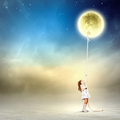 Obraz na płótnie Canvas Little girl pulling moon