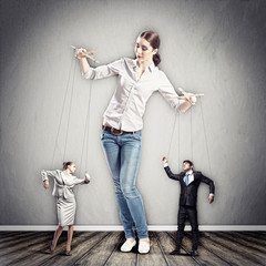 Businesswoman puppeteer