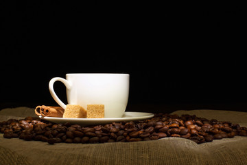 Coffee beans and white cup