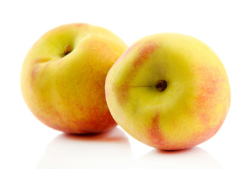 Ripe sweet peaches, isolated on white