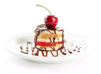 Tasty biscuit cake with chocolate and berry