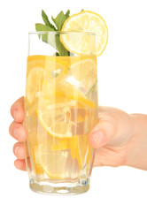 Glasses of fruit drinks with ice cubes in hand isolated on