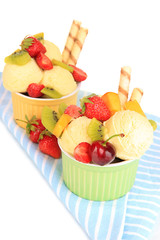 Delicious  ice cream with fruits and berries in bowl isolated