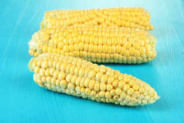 Fresh corn on color wooden background