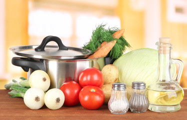 Ingredients for cooking soup on table in kitchen