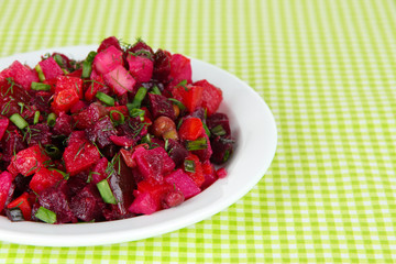 Beet salad in plate on table close-up