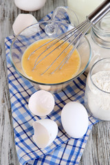 Ingredients for dough on wooden table close-up