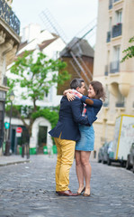 Couple kissing in Paris on Montmartre