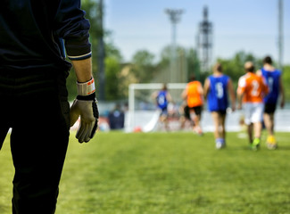 Silhouette goalkeeper at gate