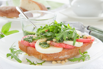 Ciabatta with tomato, mozzarella and rocket salad