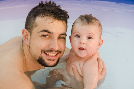 Smiling Father And Baby And Pool