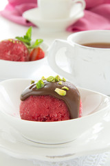 Strawberry sorbet with chocolate and pistachios.
