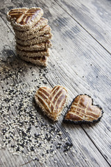 Cookies in the shape of heart on the table. Vertical shot.