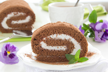 Chocolate roll with cream.