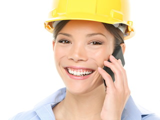Engineer - Woman with Hardhat on Mobile Phone